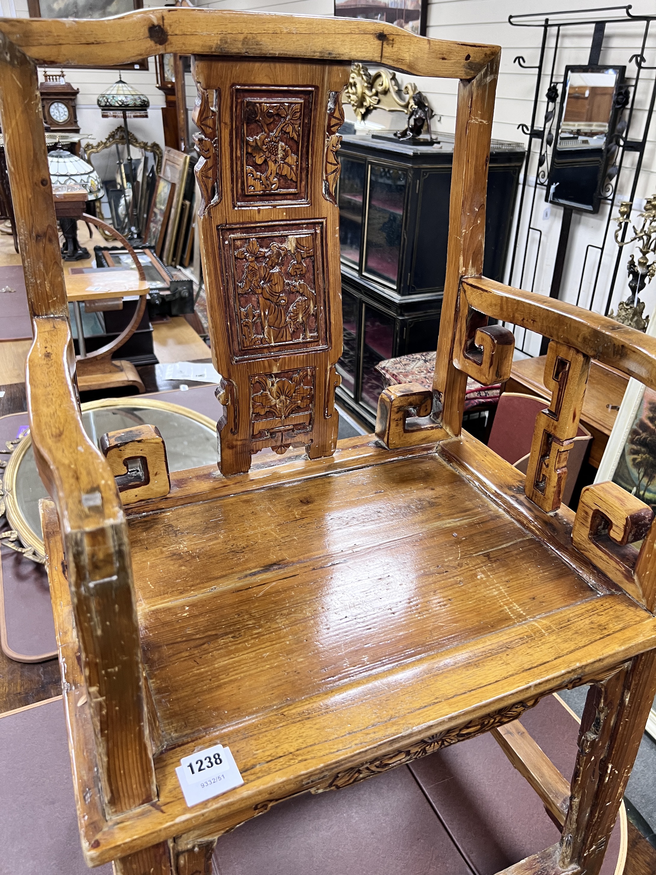 A Chinese carved pine armchair, width 57cm